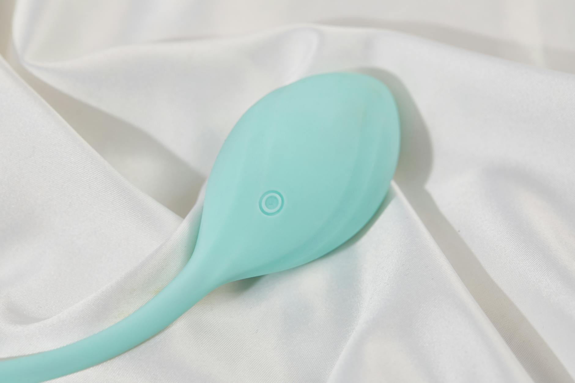 A young couple standing together indoors holding a vibrator, symbolizing modern intimacy while managing mental health